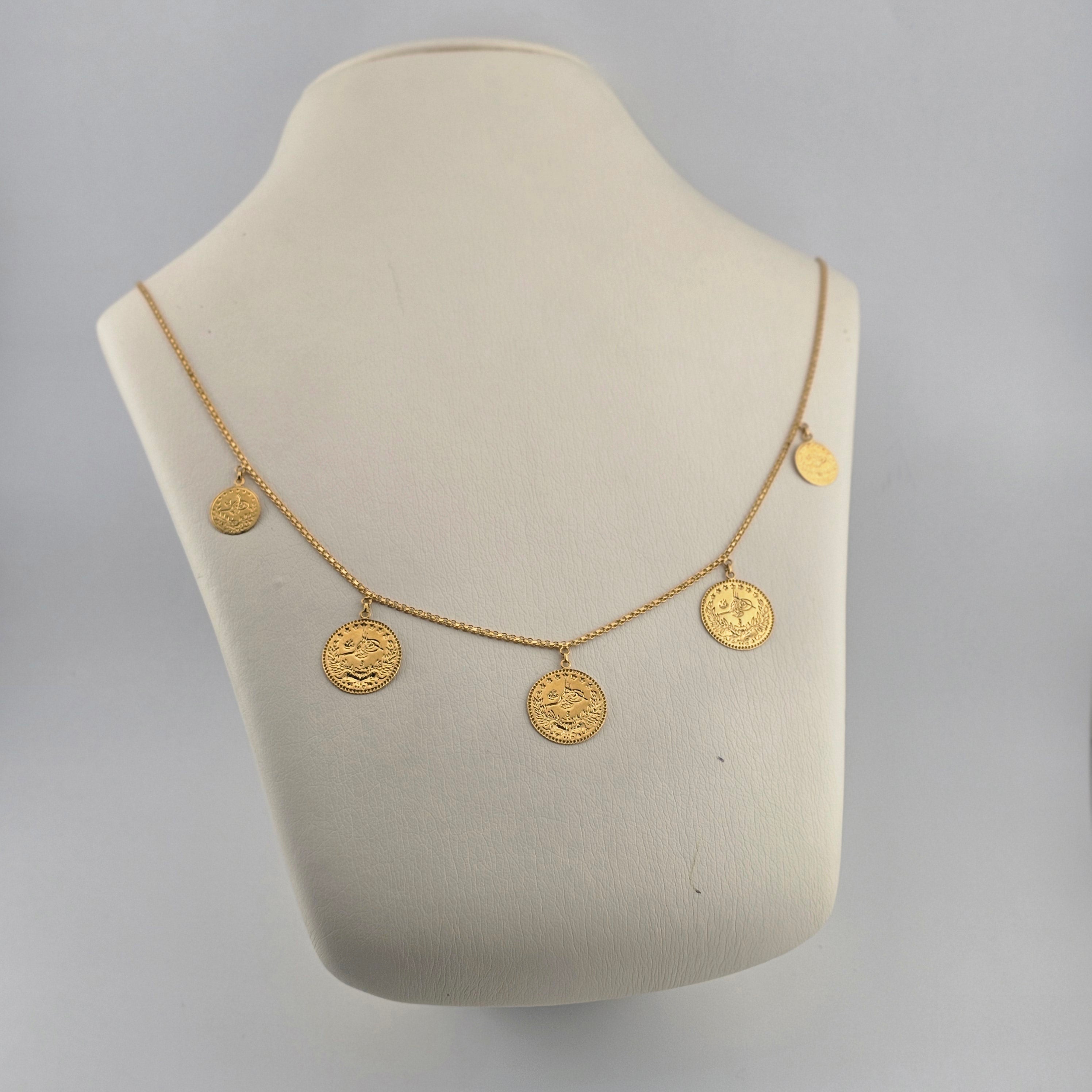قلادة من الذهب عيار 21 قيراطًا على شكل عملة معدنية - 6.51 جرام